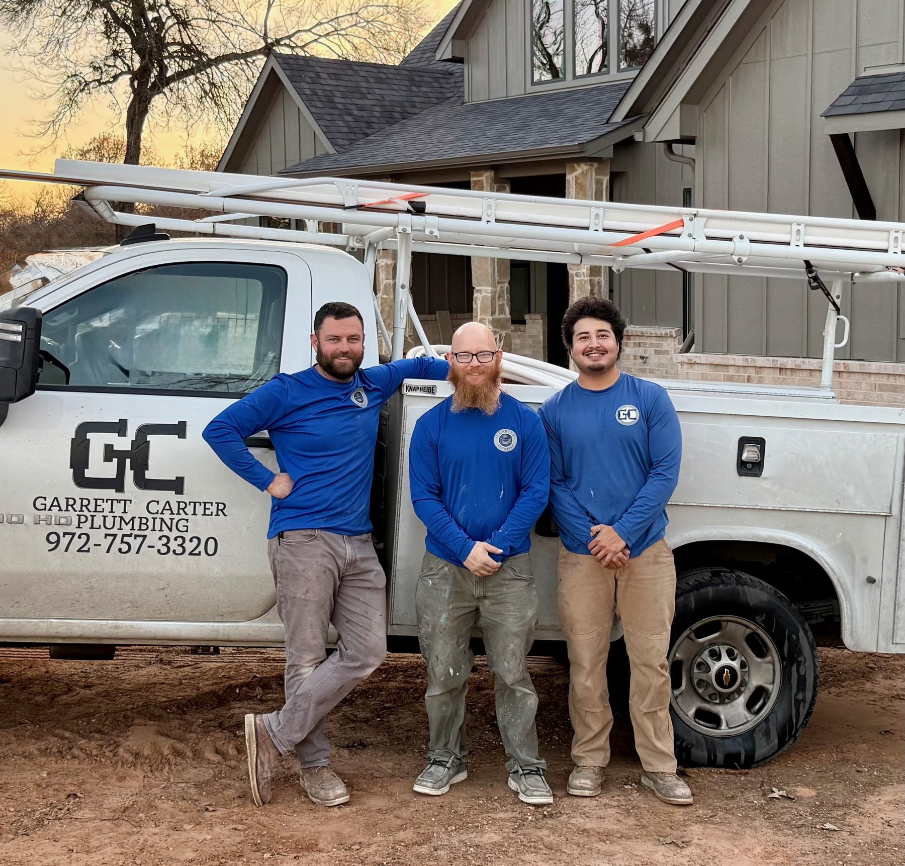 Garrett Carter and the crew in front of the Garrett Carter Plumbing truck