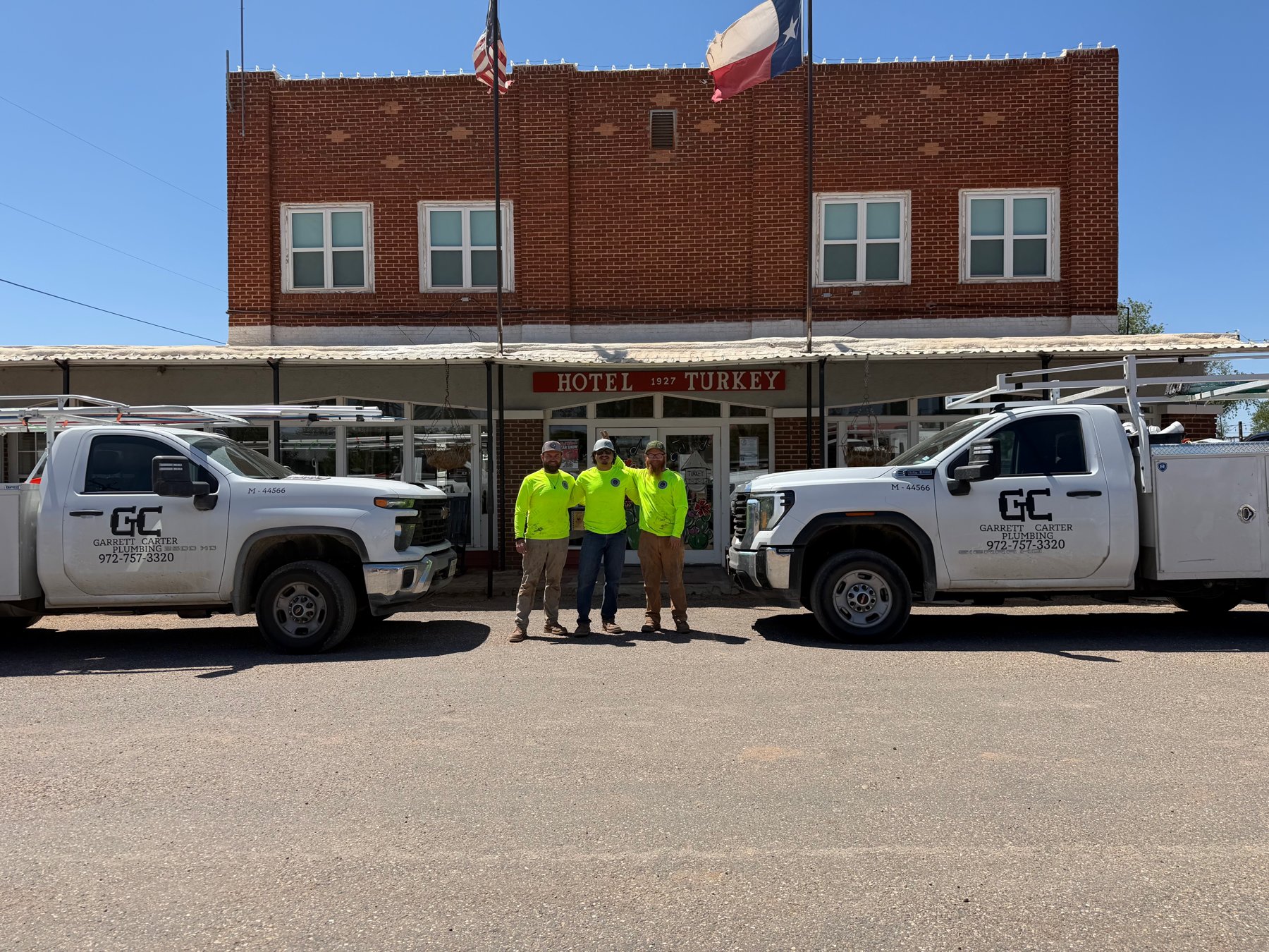 Garrett Carter Plumbing crew with company trucks