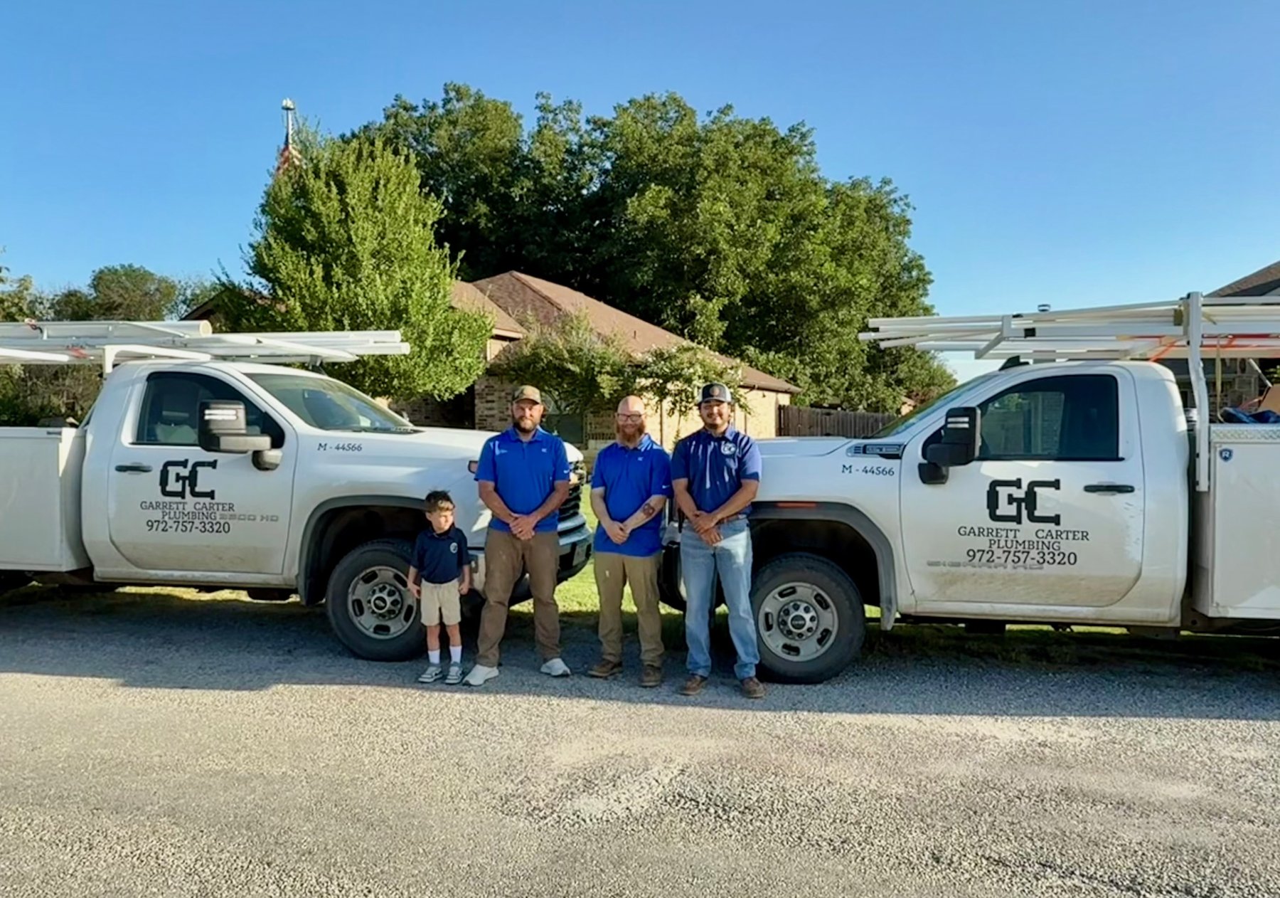 Team members with a Garrett Carter Plumbing truck