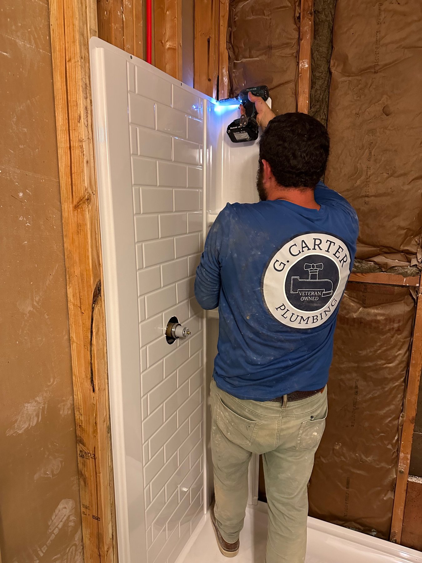 Team member installing a shower valve