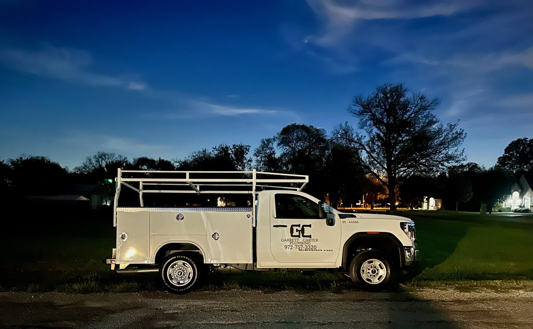 Garrett Carter Plumbing truck at dusk